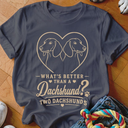 Dark grey t-shirt with two dachshunds in a heart and text: "WHAT'S BETTER THAN A Dachshund? TWO DACHSHUNDS"