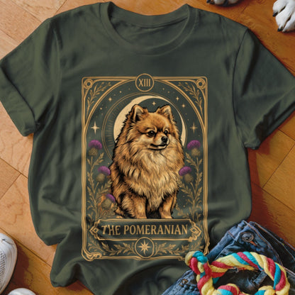 Dark green crewneck t-shirt featuring a tarot card graphic of a Pomeranian surrounded by thistles and stars.