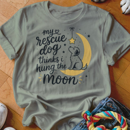 T-shirt with graphic "my rescue dog thinks I hung the moon" and a dog on a crescent moon.