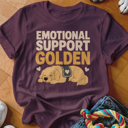 Maroon t-shirt with text "EMOTIONAL SUPPORT GOLDEN" above an illustration of a sleeping golden retriever.