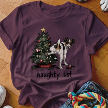 Jack Russell Terrier next to a Christmas tree with text "naughty list".