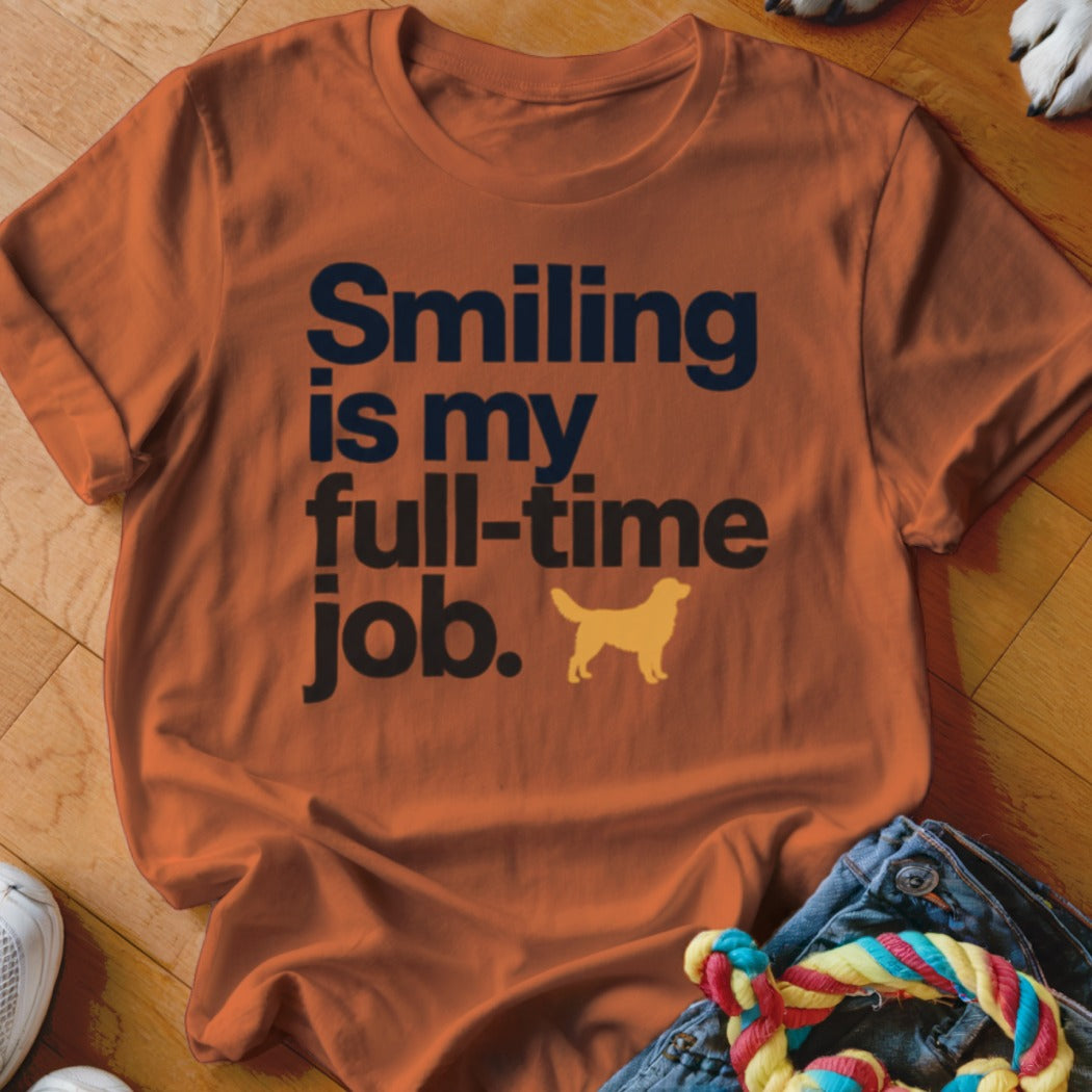 Orange t-shirt with "Smiling is my full-time job" text and golden retriever silhouette.