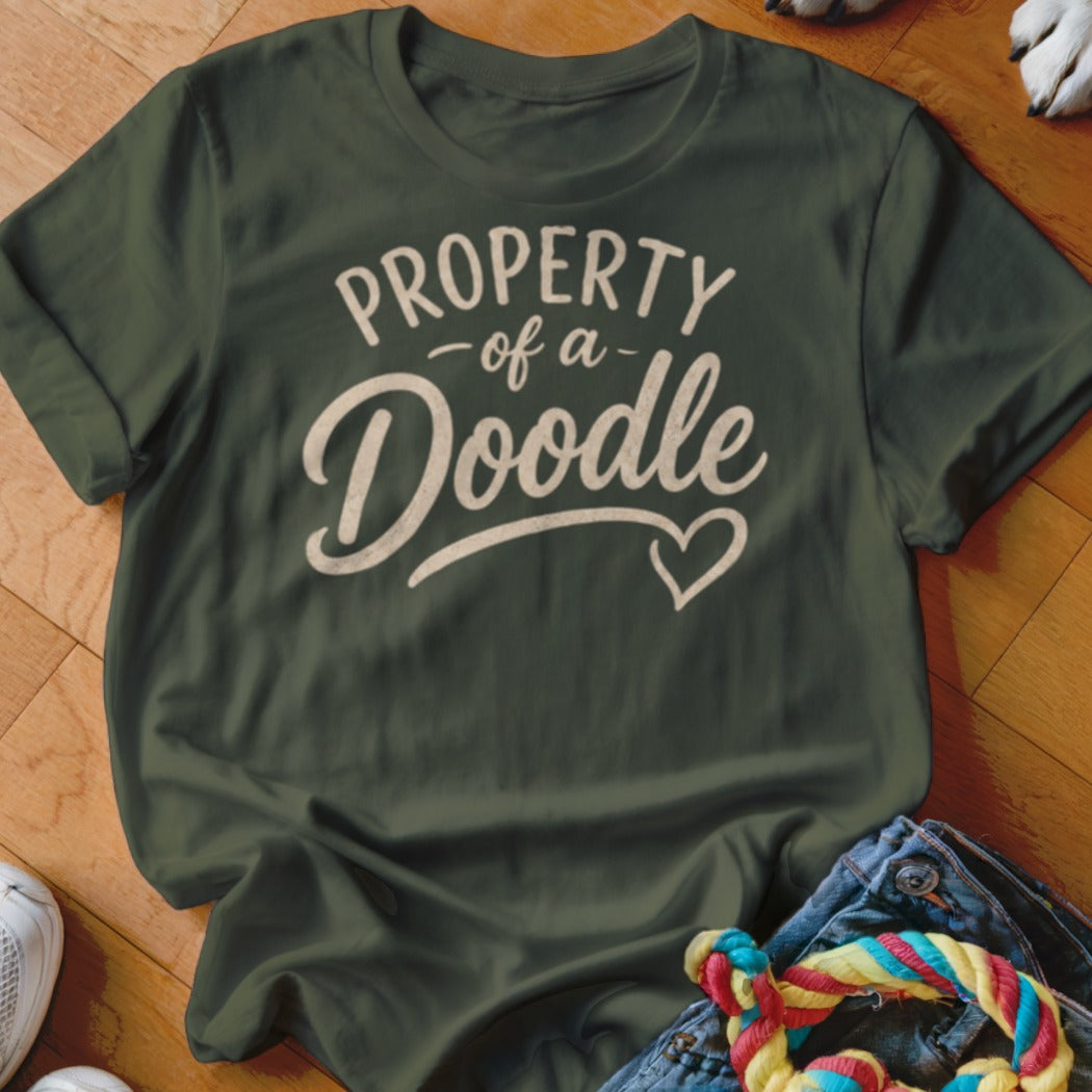 Green t-shirt with "PROPERTY of a Doodle" text and a heart.