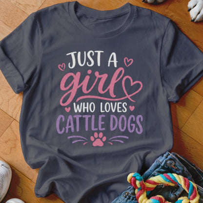Dark t-shirt with "Just a girl who loves cattle dogs" text and paw print.