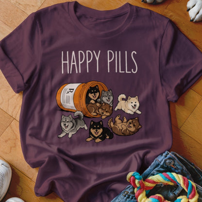 T-shirt with "Happy Pills" text and cartoon puppies spilling from a pill bottle.