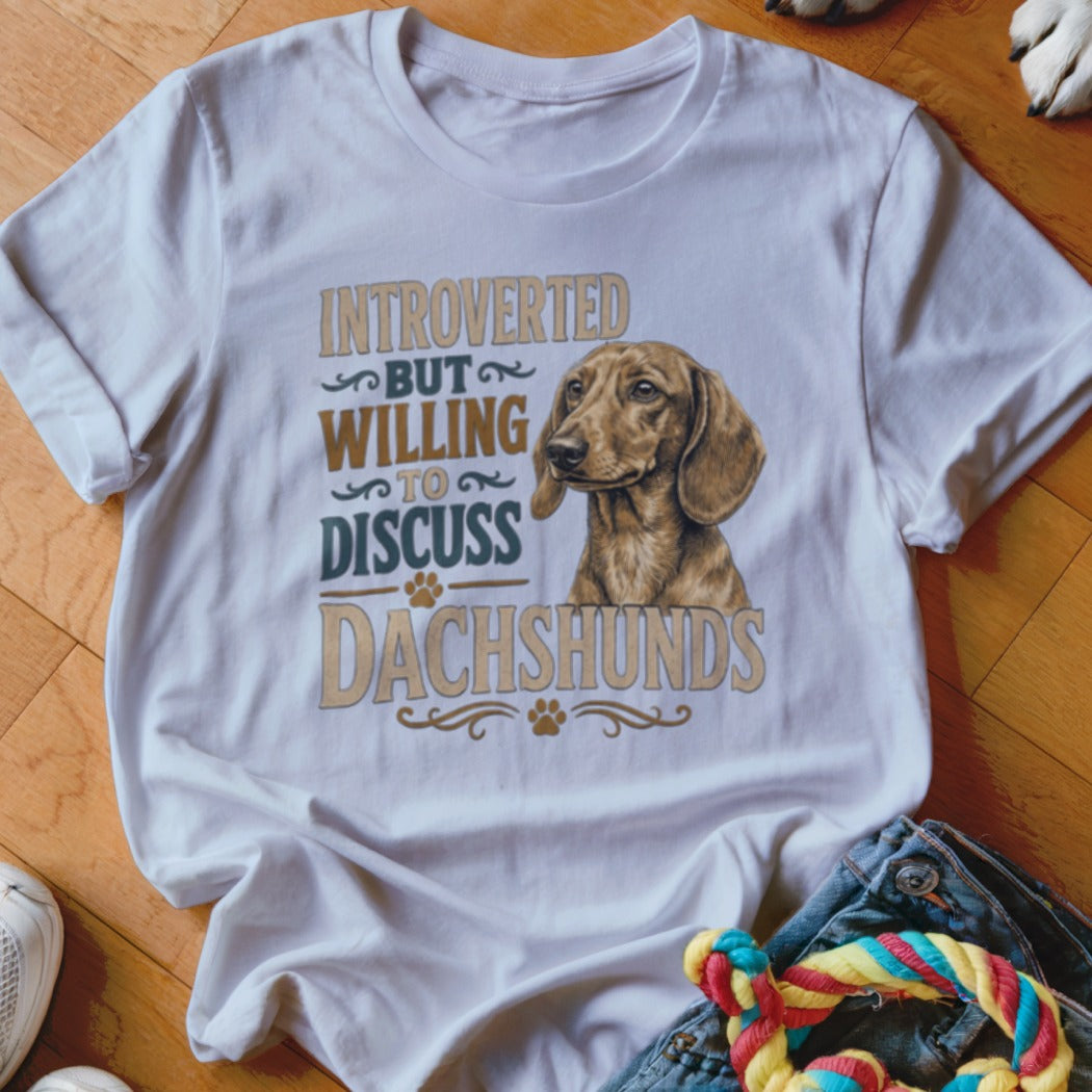 White t-shirt with dachshund illustration and text "Introverted But Willing To Discuss Dachshunds".