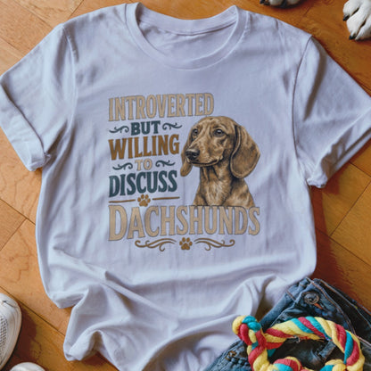 White t-shirt with dachshund illustration and text "Introverted But Willing To Discuss Dachshunds".