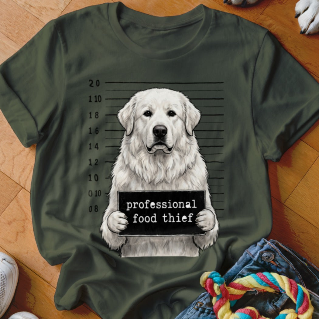 White dog in mugshot with sign reading "professional food thief".