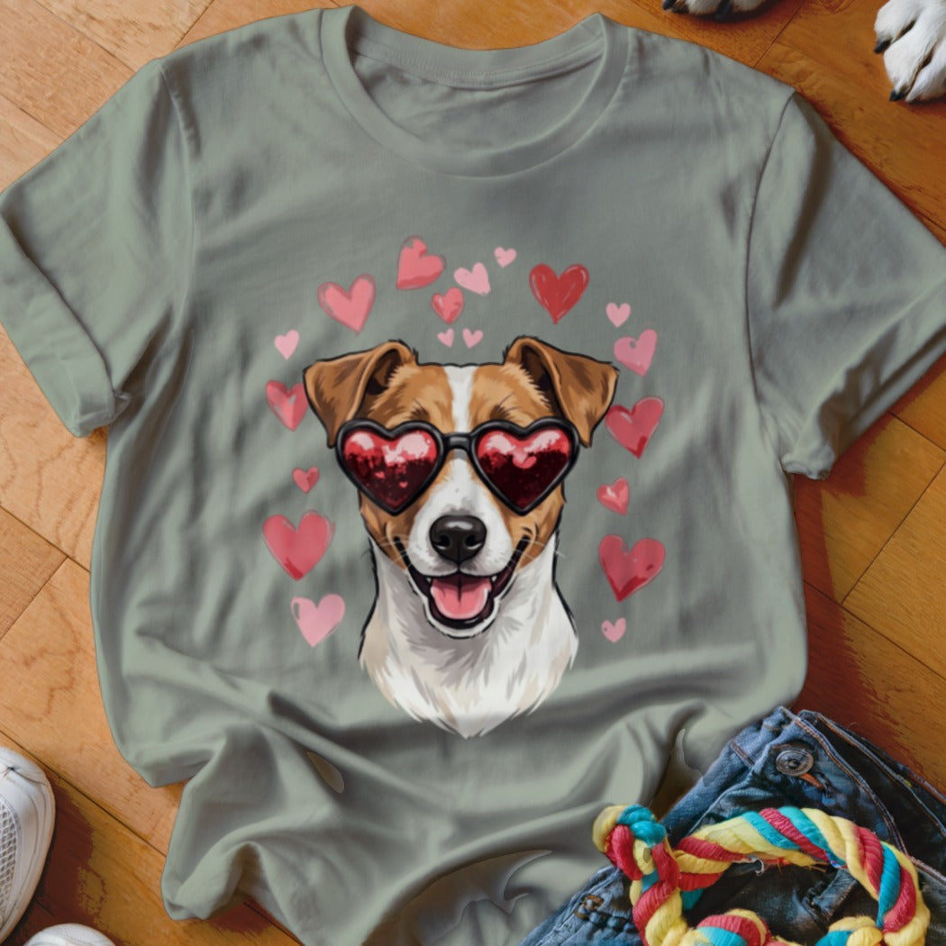 Sage green t-shirt featuring a graphic of a Jack Russell Terrier wearing heart-shaped sunglasses surrounded by pink hearts.