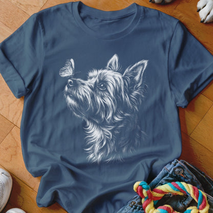Navy blue crewneck t-shirt featuring a white sketch of a terrier dog looking at a butterfly on its nose.