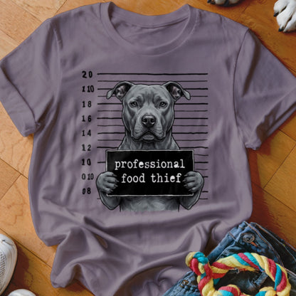Pit bull mugshot on t-shirt reads "professional food thief".