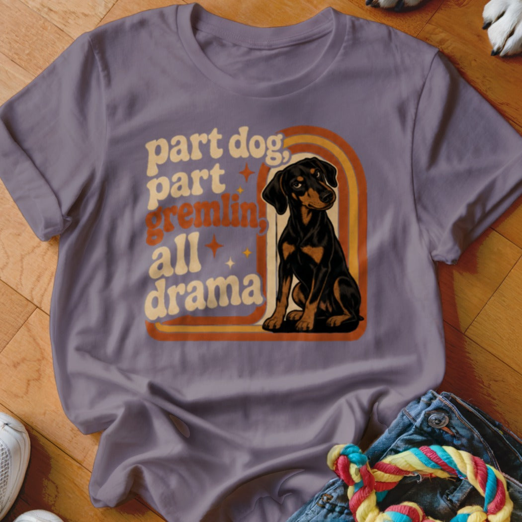 Purple t-shirt with retro design: "part dog, part gremlin, all drama" and a sitting dog.