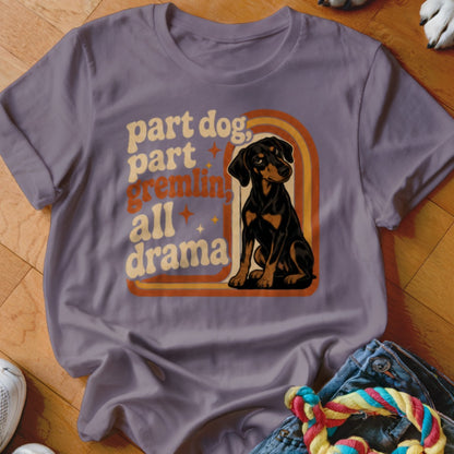Purple t-shirt with retro design: "part dog, part gremlin, all drama" and a sitting dog.