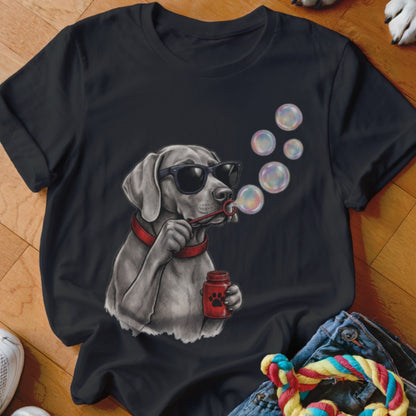 A black t-shirt featuring a gray dog wearing sunglasses, holding a jar and blowing bubbles.