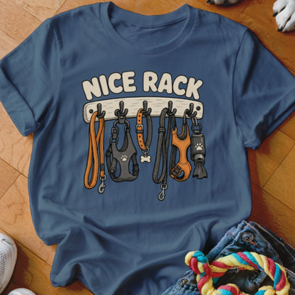 T-shirt with "NICE RACK" text and leashes, harnesses, and a treat dispenser hanging on hooks.