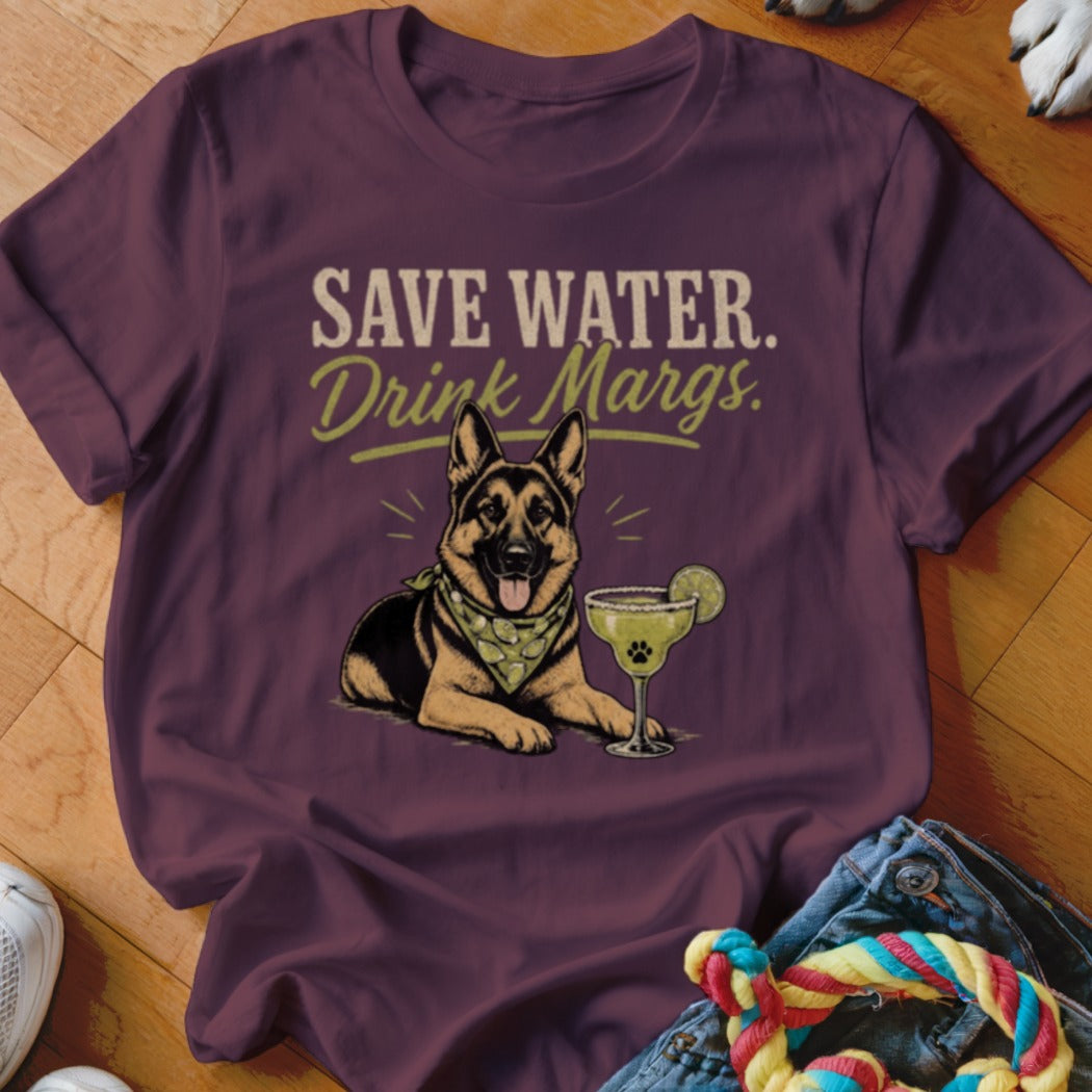 German Shepherd wearing bandana, next to margarita with lime, on burgundy t-shirt.