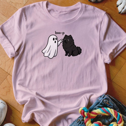 Pink t-shirt with a graphic of a ghost booping a black dog and the text "boo-p".