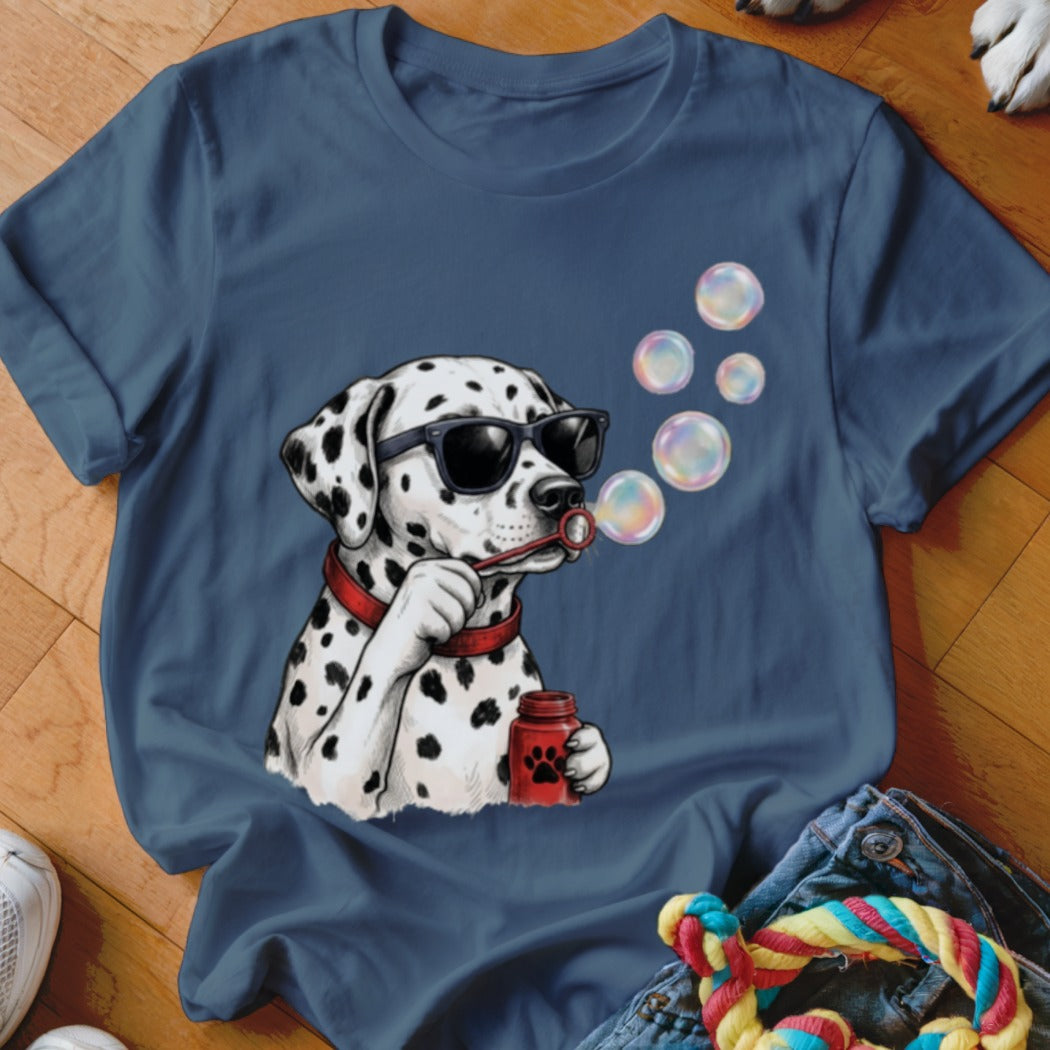A dark blue t-shirt printed with a graphic of a Dalmatian wearing sunglasses and blowing bubbles.