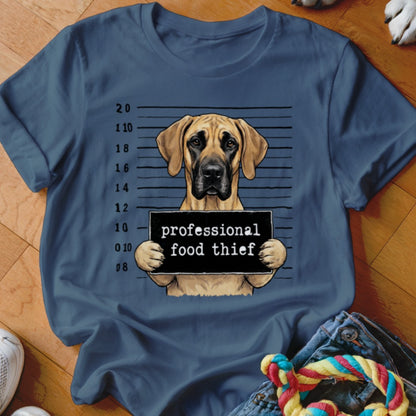 Great Dane in mugshot holding sign that reads "professional food thief".