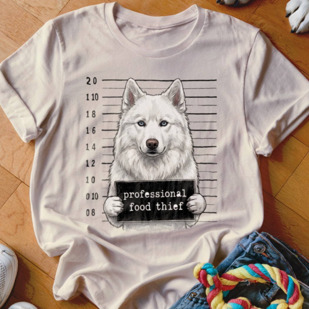 White husky mugshot t-shirt with "professional food thief" sign.