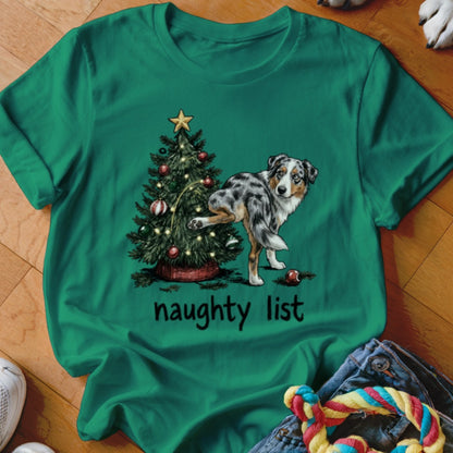 Australian Shepherd next to Christmas tree, text "naughty list"