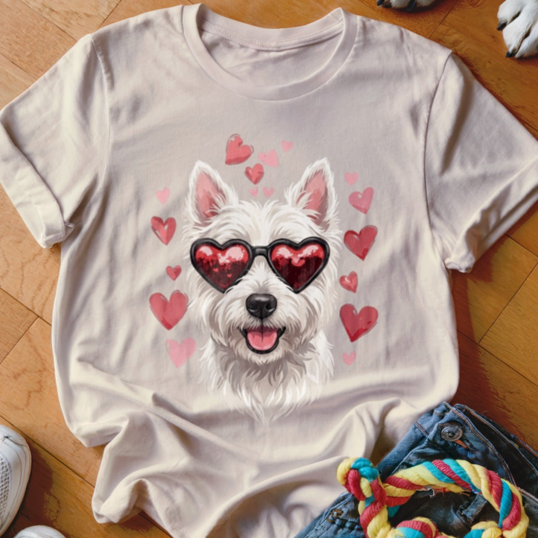 Beige t-shirt featuring a graphic of a white Westie dog wearing heart-shaped sunglasses, surrounded by pink hearts.