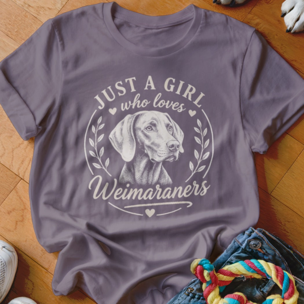Gray t-shirt with illustration of a Weimaraner and text "Just a girl who loves Weimaraners".