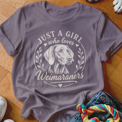 Gray t-shirt with illustration of a Weimaraner and text "Just a girl who loves Weimaraners".