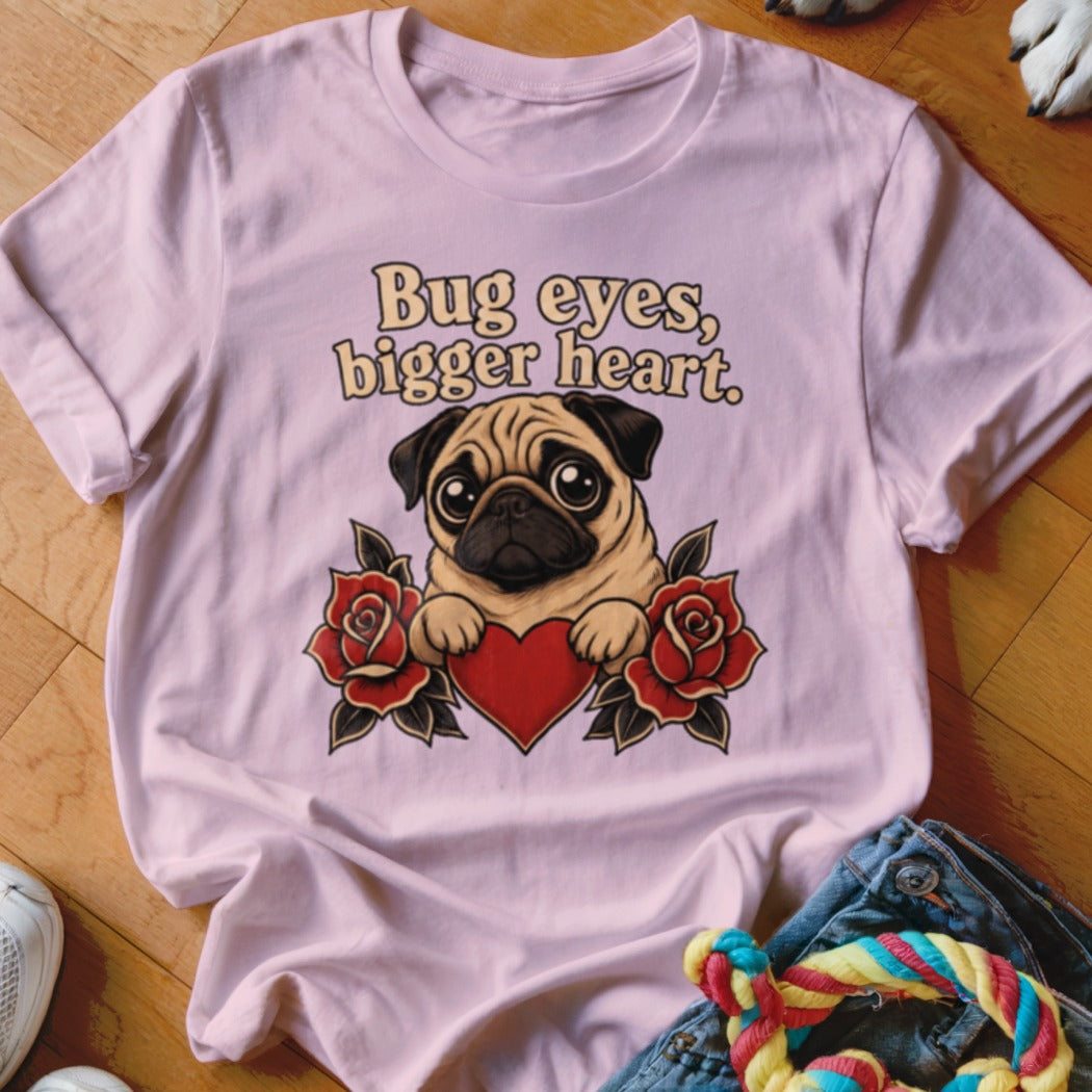 Pink t-shirt with a pug, heart, and roses graphic and text "Bug eyes, bigger heart."