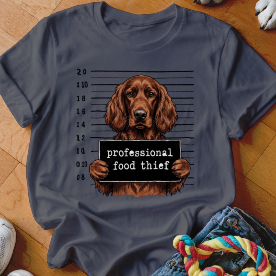 Irish Setter mugshot with sign reading "professional food thief."