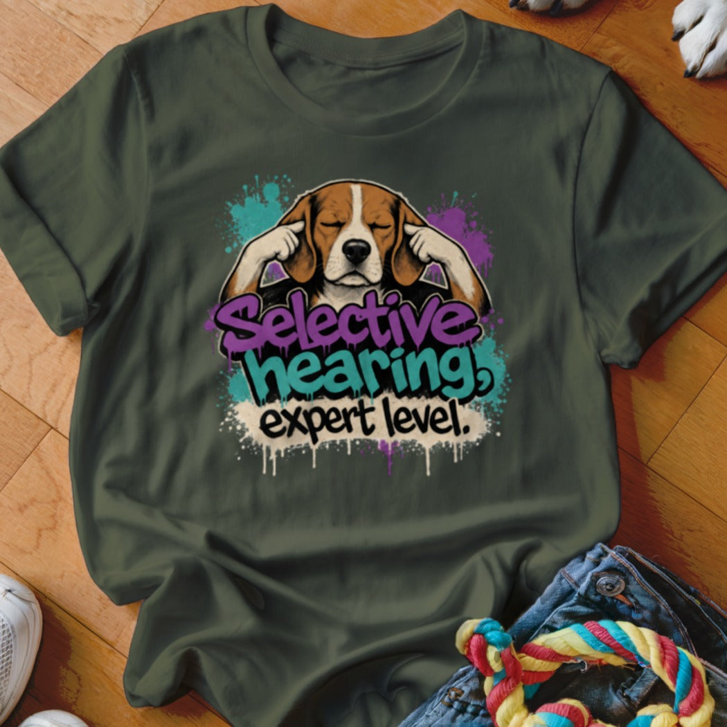 Beagle with ears covered and text "Selective hearing, expert level."