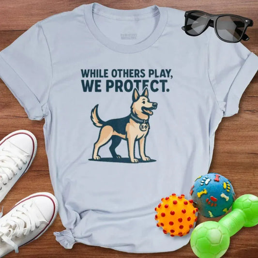 While Others Play Shirt - The Pawsitive Initiative