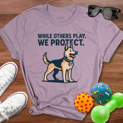 While Others Play Shirt - The Pawsitive Initiative